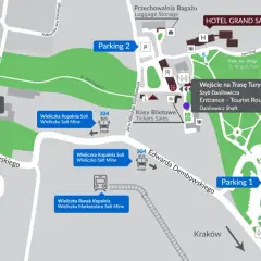 Mapa terenu Kopalni Soli w Wieliczce. Widać wejścia na Trasy Górniczą i Turystyczną, kasy biletowe, parkingi, uzdrowisko, Tężnię Solankową oraz kierunek do Krakowa.